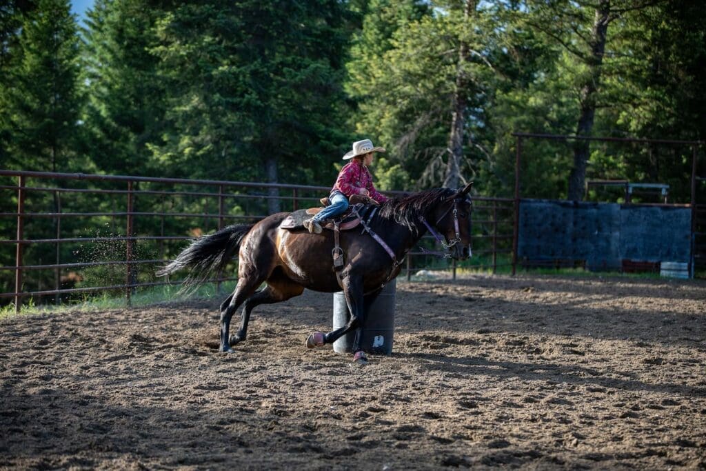 Young girl riding a horse in a ranch, illustrating local internet connectivity in ranches and rural areas