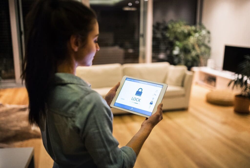 Woman using an iPad to showcase network security solutions for business internet protection