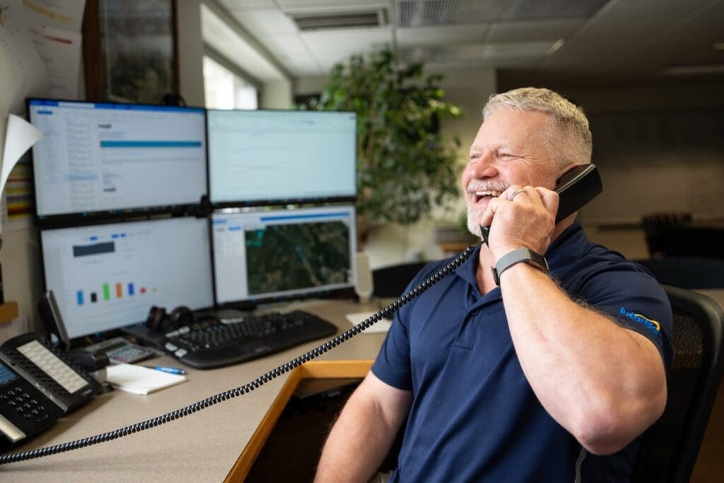 InterBel staff speaking on the phone about a three-month free internet promotion for customers
